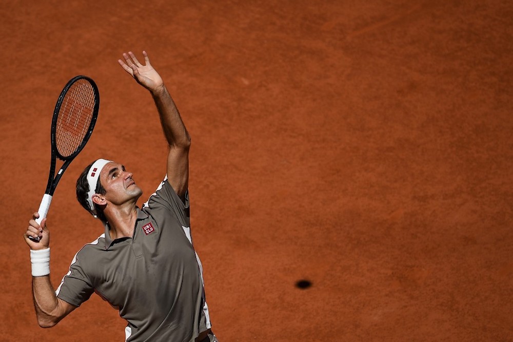 Switzerlandu00e2u20acu2122s Roger Federer serves the ball to Argentinau00e2u20acu2122s Leonardo Mayer during their menu00e2u20acu2122s singles fourth-round match at the 2019 French Open in Paris June 2, 2019. u00e2u20acu201d AFP pic