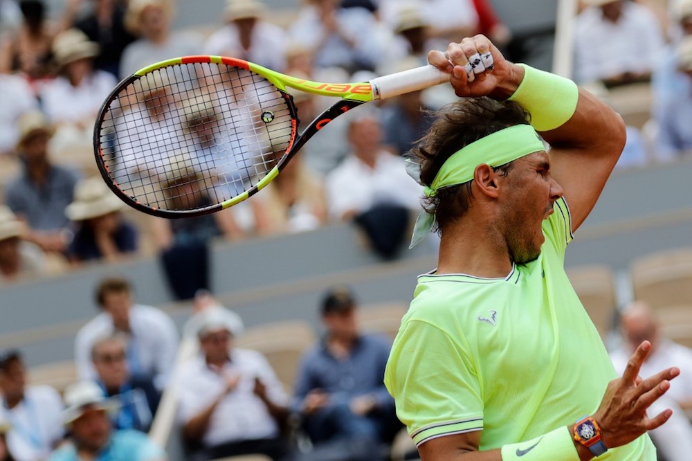 Spain’s Rafael Nadal serves the ball to Japan’s Kei Nishikori during their men’s singles quarter-final match at the 2019 French Open in Paris June 4, 2019. — AFP pic