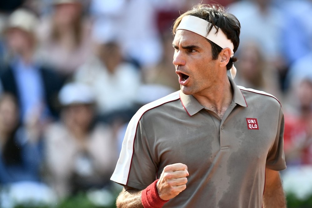 Switzerlandu00e2u20acu2122s Roger Federer reacts after winning a point against Switzerlandu00e2u20acu2122s Stanislas Wawrinka during their menu00e2u20acu2122s singles quarter-final match at the 2019 French Open in Paris June 4, 2019. u00e2u20acu201d AFP pic