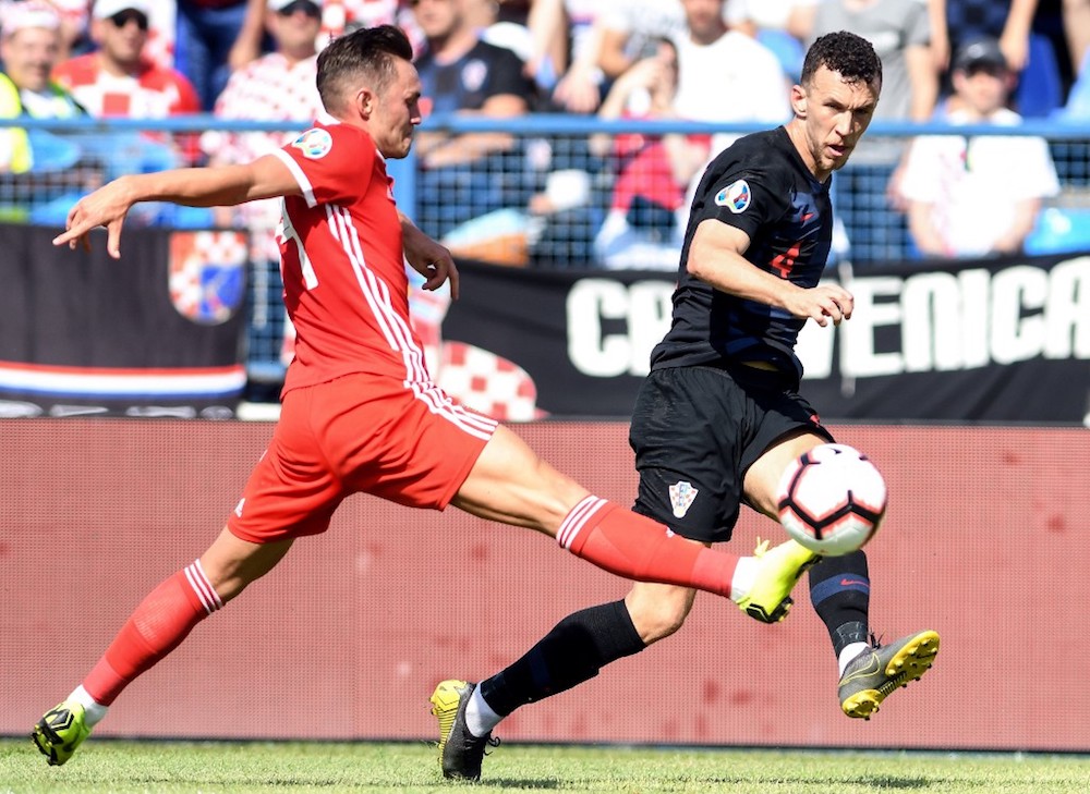 Croatiau00e2u20acu2122s Ivan Perisic vies with Walesu00e2u20acu2122 Connor Roberts during their Euro 2020 qualification match at Gradski vrt stadium in Osijek June 8, 2019. u00e2u20acu201d AFP pic