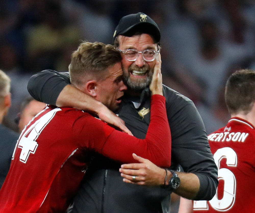Liverpool manager Jurgen Klopp celebrates with Jordan Henderson after winning the Uefa Champions League final at Wanda Metropolitano in Madrid June 1, 2019. u00e2u20acu201d Reuters pic