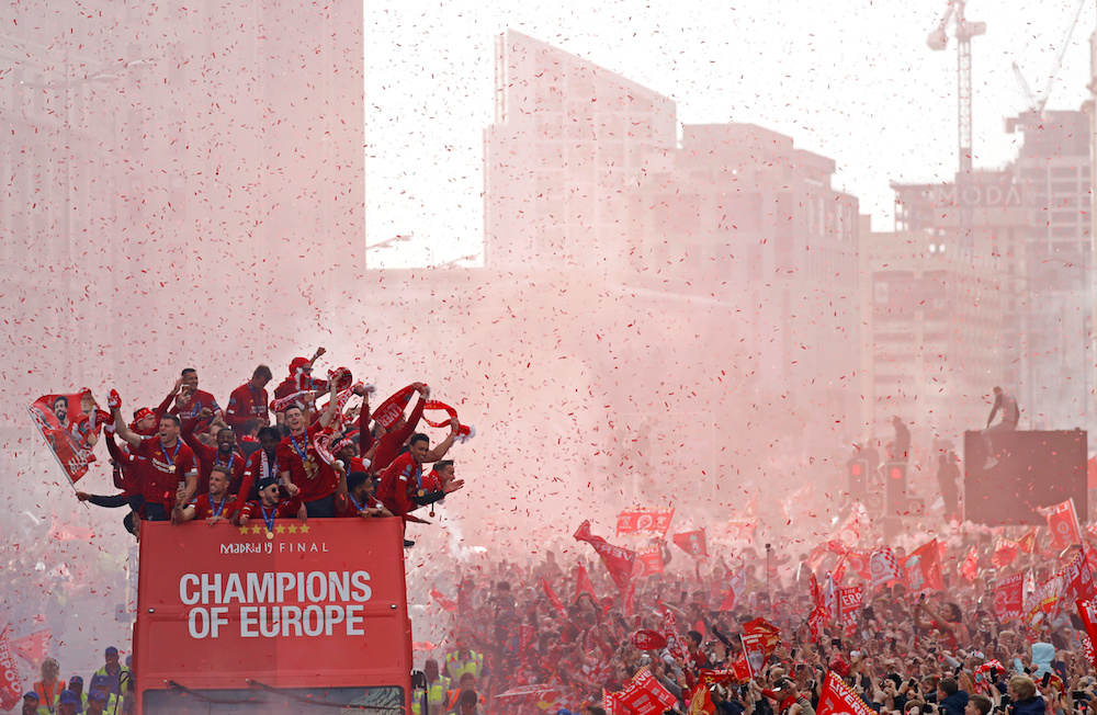 Liverpoolu00e2u20acu2122s team bus travels past fans during the Champions League victory parade in Liverpool June 2, 2019. u00e2u20acu201d Reuters pic