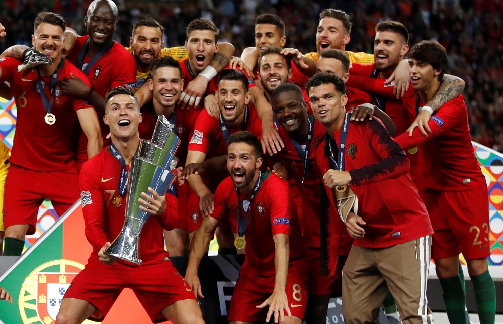 Portugal's Cristiano Ronaldo and team mates celebrate winning the Uefa Nations League Final with the trophy at Porto June 9, 2019. u00e2u20acu201d Action Images via Reuters