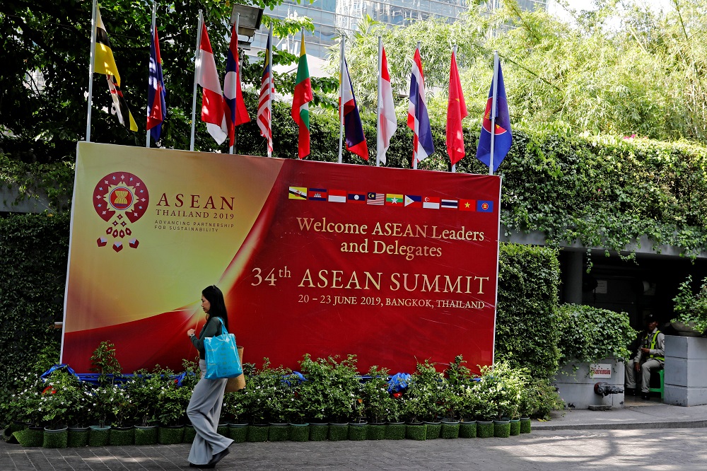 A woman walks past a banner at the venue of the upcoming Asean summit in Bangkok June 21, 2019. u00e2u20acu201d Reuters pic