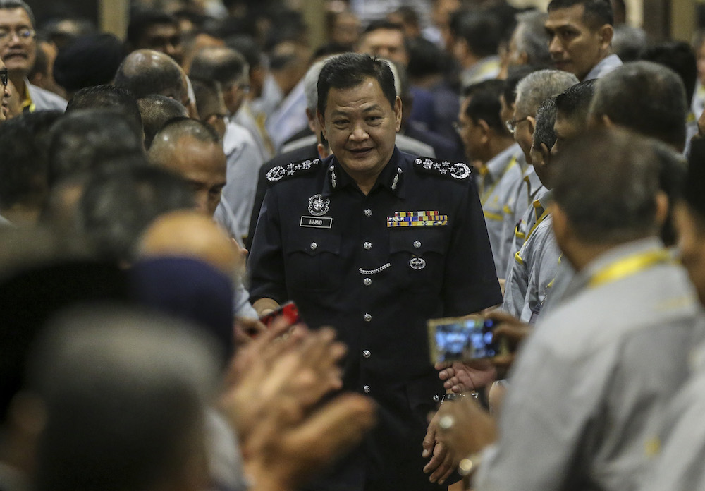 IGP Datuk Seri Abdul Hamid Bador (centre) attends the Police Co-operativeu00e2u20acu2122s 84th Annual Grand Meeting in Kuala Lumpur June 26, 2019. u00e2u20acu201d Picture by Firdaus Latif
