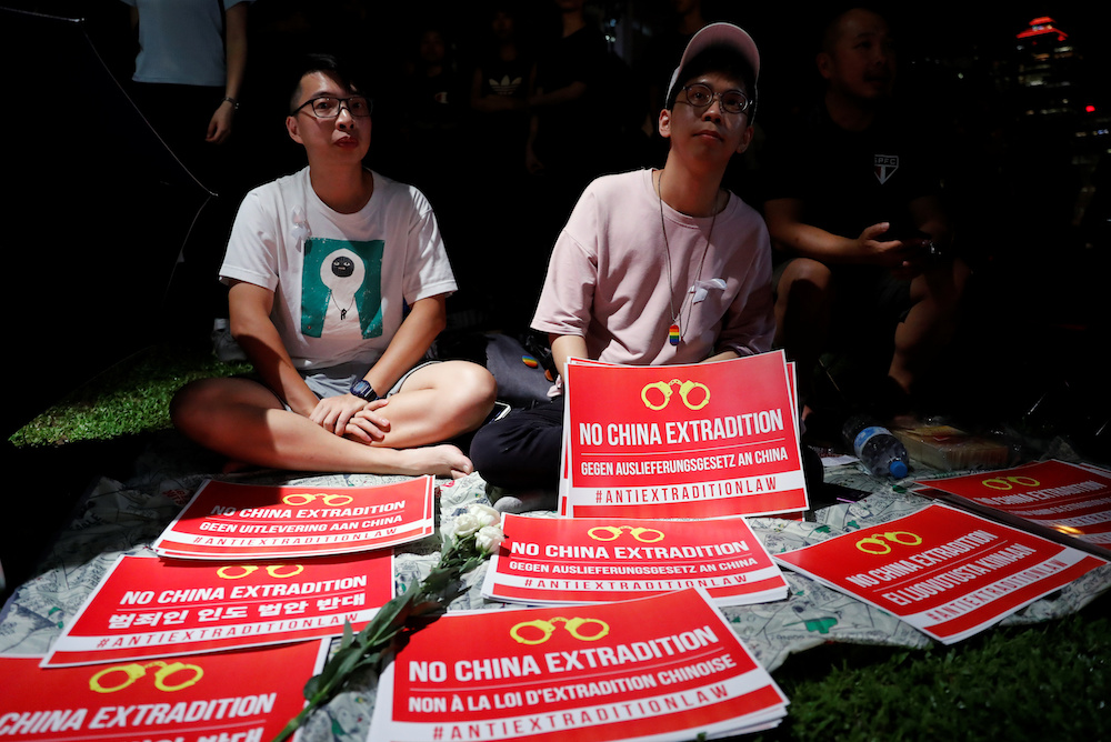 Protest placards and flowers are displayed during a demonstration to demand authorities scrap a proposed extradition bill with China, in Hong Kong June 11, 2019. u00e2u20acu201d Reuters picnn