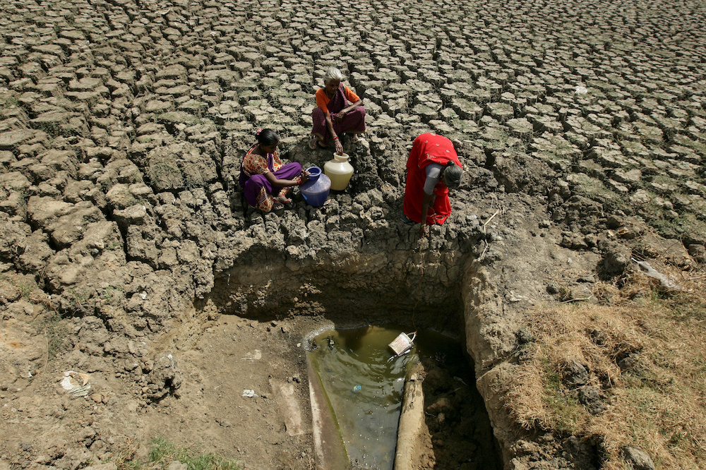 Women fetch water from an opening made by residents at a dried-up lake in Chennai June 11, 2019. u00e2u20acu201d Reuters picnn