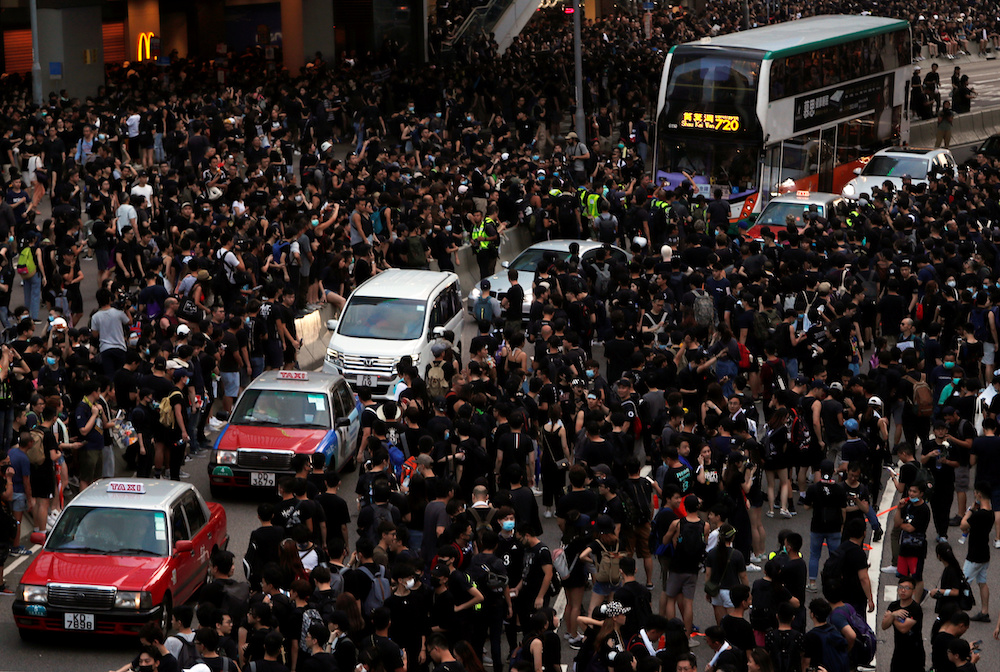 Protesters block the street during a demonstration demanding Hong Kong's leaders to step down and withdraw the extradition bill, in Hong Kong June 16, 2019. u00e2u20acu201d Reuters picnn