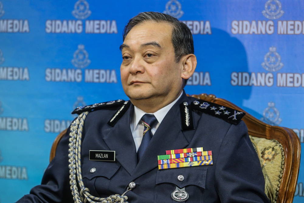 Deputy Inspector-General of Police, Datuk Mazlan Mansor (centre) speaks to reporter at the press conference in Bukit Aman June 17, 2019. u00e2u20acu201d Picture by Hari Anggara