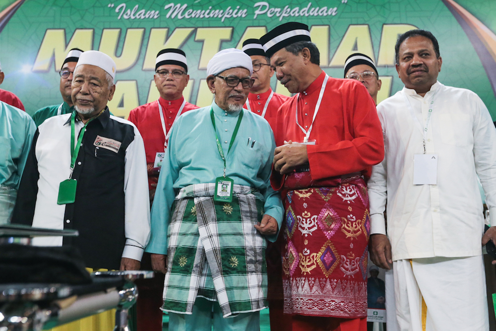 Datuk Seri Mohamad Hasan interacts with Datuk Seri Abdul Hadi Awang during the 65th PAS Muktamar in Kuantan June 21, 2019. u00e2u20acu201d Picture by Mukhriz Hazim