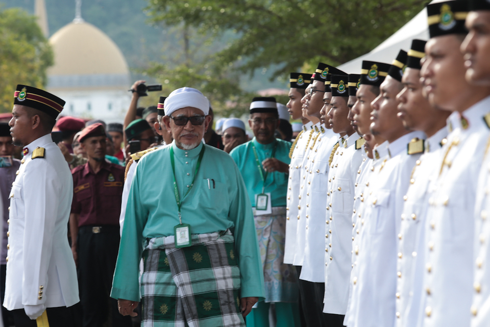 PAS president Datuk Seri Abdul Hadi Awang inspects a Unit Amal guard of honour during the 65th PAS Muktamar in Kuantan June 21, 2019. u00e2u20acu201d Picture by Ahmad Zamzahuri