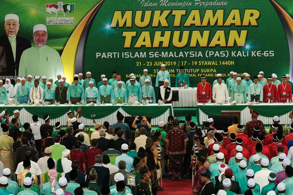 PAS and Umno leaders share the stage during the 65th PAS Muktamar in Kuantan June 21, 2019. — Picture by Ahmad Zamzahuri