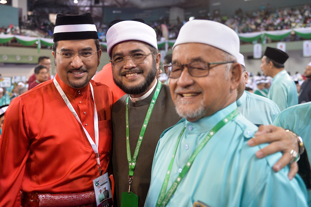 Datuk Asyraf Wajdi Dusuki and Datuk Nik Muhammad Zawawi Sanasee attend the 65th PAS Muktamar in Kuantan June 21, 2019. — Picture by Mukhriz Hazim