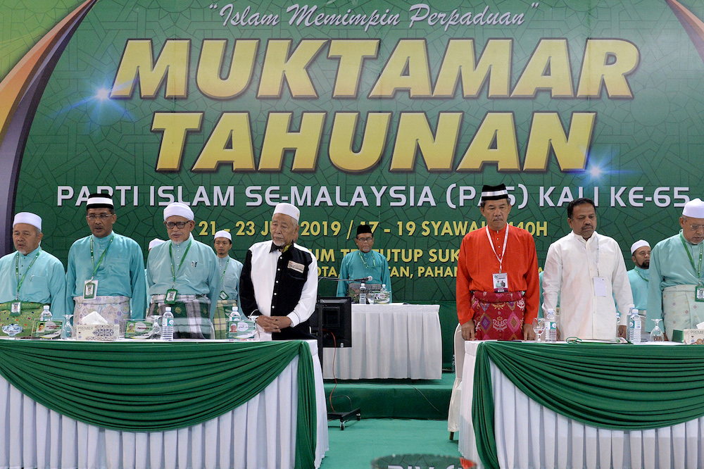 Datuk Seri Mohamad Hasan and Tan Sri SA Vigneswaran share the stage with PAS leaders during the 65th PAS Muktamar in Kuantan June 21, 2019. u00e2u20acu201d Picture by Mukhriz Hazim
