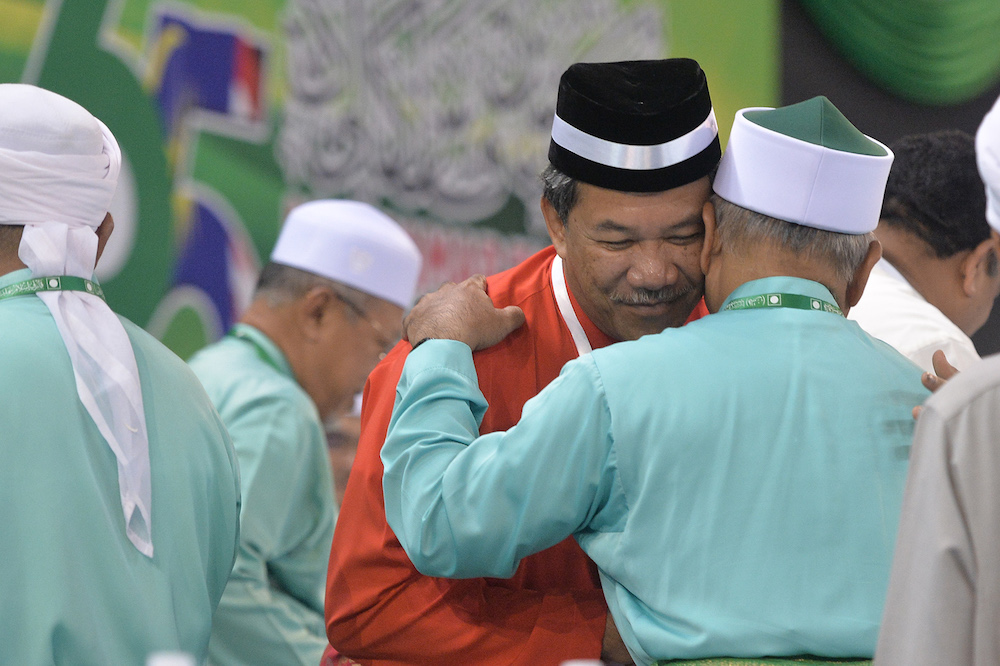 Datuk Seri Mohamad Hasan is greeted by PAS leaders during the 65th PAS Muktamar in Kuantan June 21, 2019. u00e2u20acu201d Picture by Mukhriz Hazim