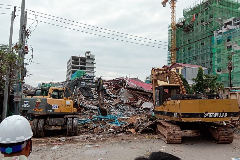 Rescue workers use earthmovers to clear debris after a building collapsed at a construction site in Sihanoukville, Cambodia June 22, 2019. u00e2u20acu201d AFP pic