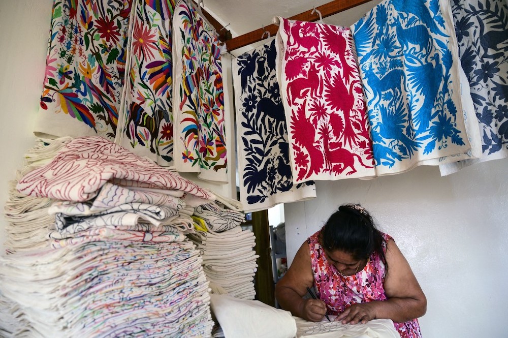 Mexican artisan Glafira Candelaria Jose, of the Otomi ethnic group, works in one of her designs at her workshop in San Nicolas village, in Tenango de Doria, Hidalgo state, Mexico, on June 18, 2019. u00e2u20acu201d AFP picnn