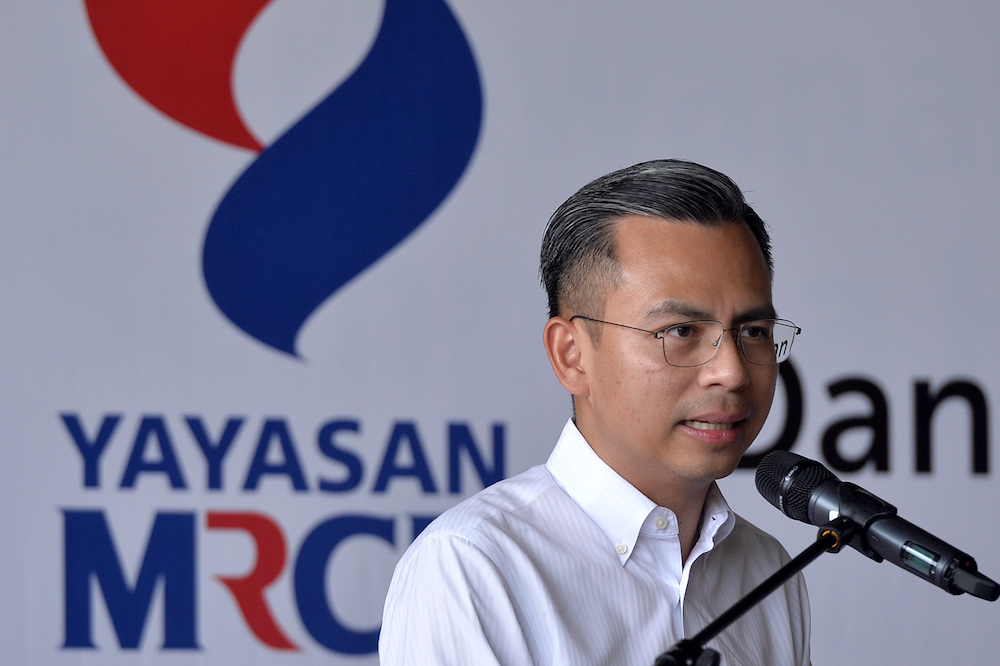 Lembah Pantai MP Fahmi Fadzil speaks during the Yayasan MRCB books and free school meal programme at SMK La Salle in Kuala Lumpur June 27, 2019. u00e2u20acu201d Picture by Mukhriz Hazim