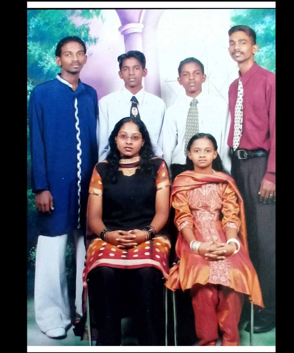 Sangkari (bottom left) made a desperate search for information on the man who had landed her brother Pannir Selvam (in blue) in Singapore’s prison. — Picture courtesy of Pannir Selvam’s family
