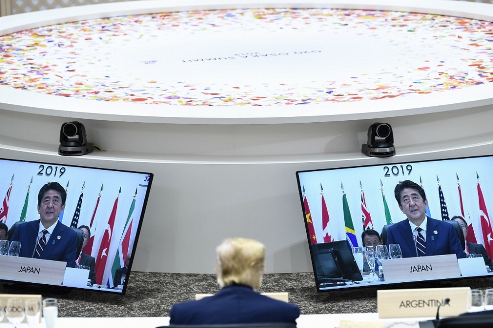 US President Donald Trump sits before screens showing Japanu00e2u20acu2122s Prime Minister Shinzo Abe during a meeting at the G20 Summit in Osaka June 28, 2019. u00e2u20acu201d AFP pic