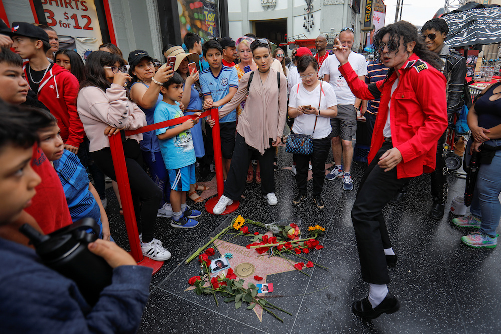 A Michael Jackson impersonator dances next to Michael Jackson's star on the Hollywood Walk of Fame ten years after the death of child star turned King of Pop in Los Angeles June 25, 2019. u00e2u20acu201d Reuters pic