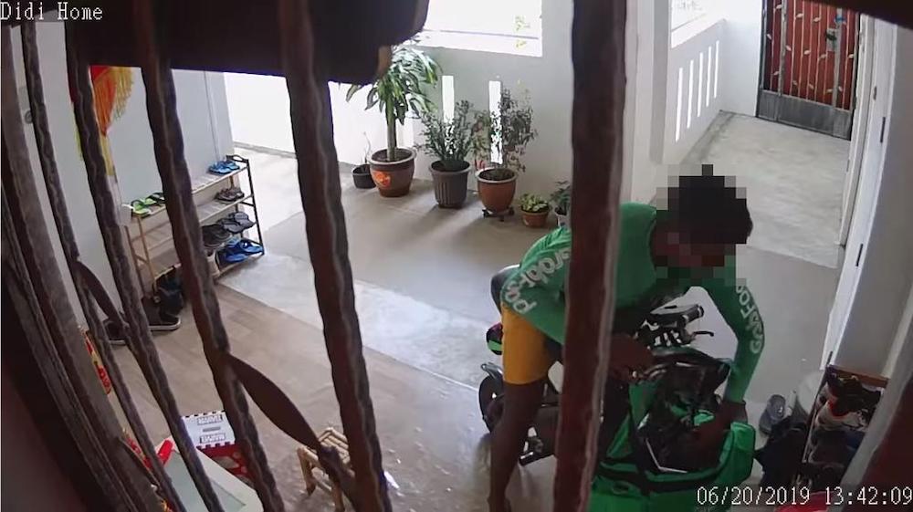 In the video, the rider was seen picking up a pair of shoes from the rack and placing them in his food bag. u00e2u20acu201d Picture courtesy of Grace Lim/Facebook via TODAY
