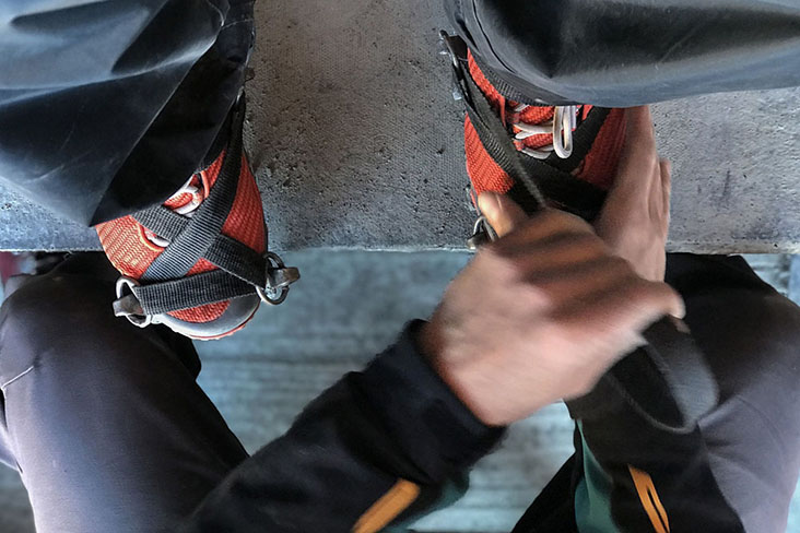 There is an art to putting on crampons properly