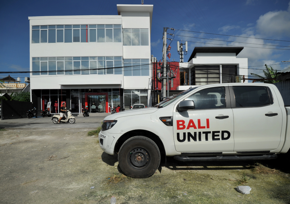 A motorist drives in front of the club house of Bali United in Denpasar, on Indonesiau00e2u20acu2122s resort island of Bali June 15, 2019. u00e2u20acu201d AFP pic 