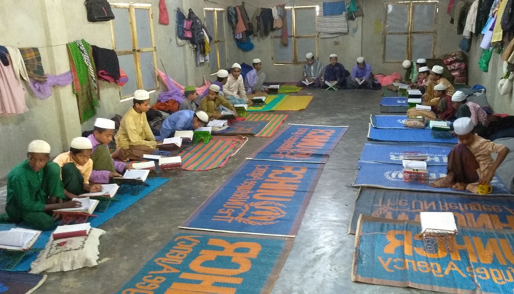 In this picture taken on March 21, 2019, Rohingya refugee children learn the Quran in a madrassa, or Islamic school, in a Rohingya refugee camp in Ukhia. u00e2u20acu201d AFP pic  