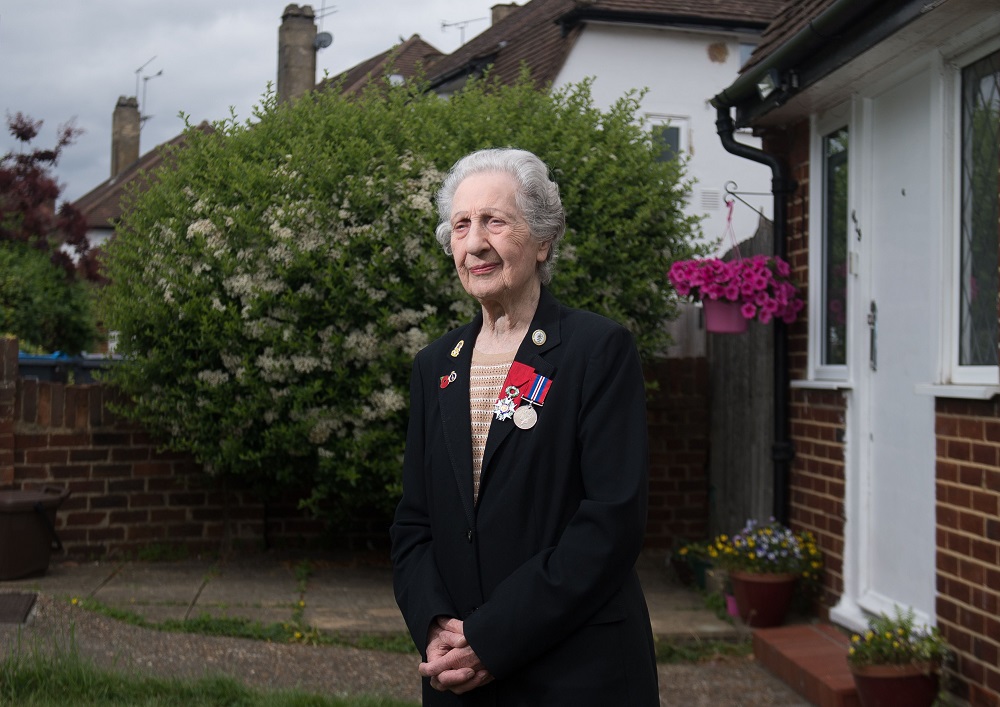 Veteran D-Day switchboard operator Marie Scott, 92, poses for a portrait wearing her WWII service medal (right) and her French Legion of Honour (Legion du00e2u20acu2122honneur) during an interview at her home in southwest London May 31, 2019. u00e2u20acu201d AFP pic       
