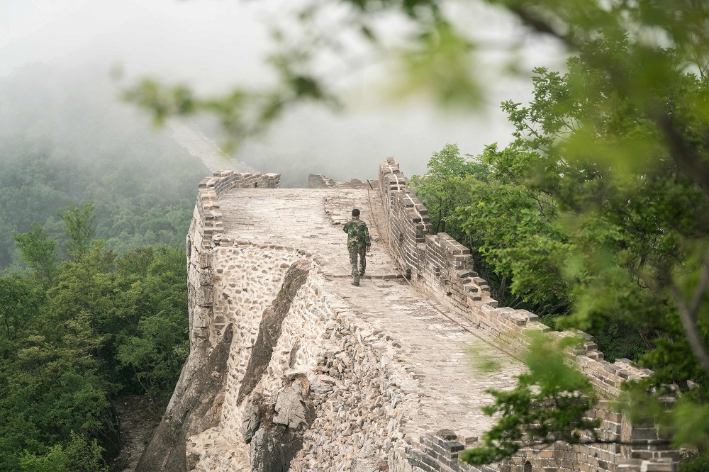 This picture taken on May 17, 2019 shows a worker walking through a restored part of the Great Wall in Xiangshuihu in Huairou District, on the outskirts of Beijing. ― AFP pic