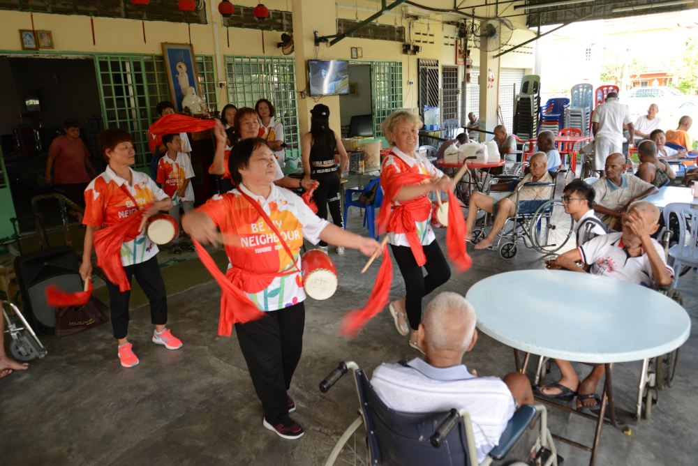 The home’s elderly residents experienced a special drum performance by the volunteers. — Picture courtesy of Country Garden Malaysia