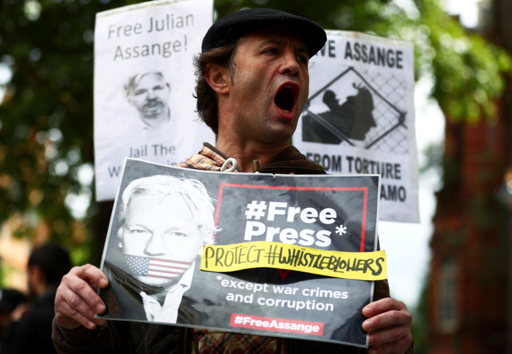 A demonstrator holding a placard protests outside of Westminster Magistrates Court, where a case hearing for US extradition of Wikileaks founder Julian Assange is held, in London, Britain, June 14, 2019. u00e2u20acu201d Reuters pic
