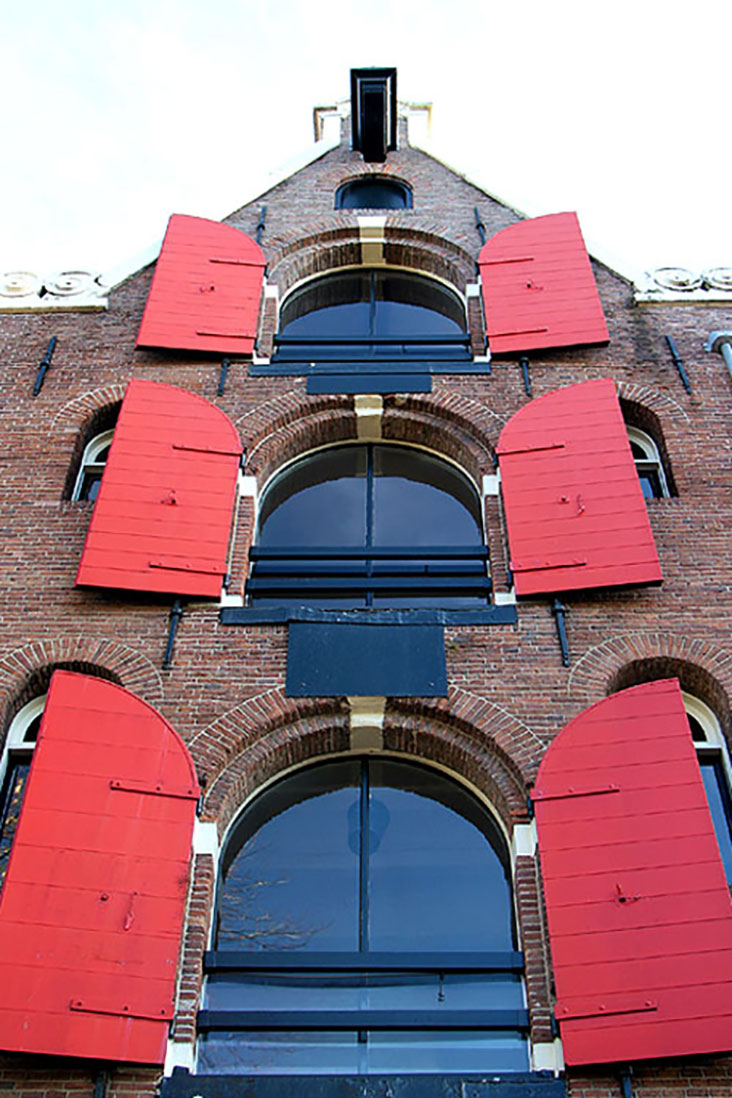 The iconic red shutters of former warehouses along Brouwersgracht