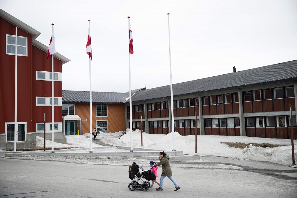 In this file photo taken on April 19, 2018 a woman and her children pass the Greenland County Council Hall in the streets of Nuuk, Greenland. u00e2u20acu201d AFP pic        