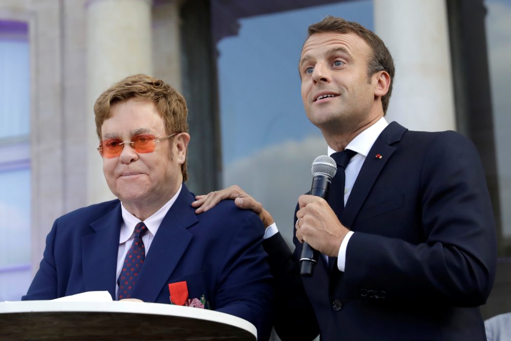 French President Emmanuel Macron and Elton John address the crowd in the courtyard of the presidential Elysee Palace in Paris June 21, 2019. u00e2u20acu2022 Reuters pic