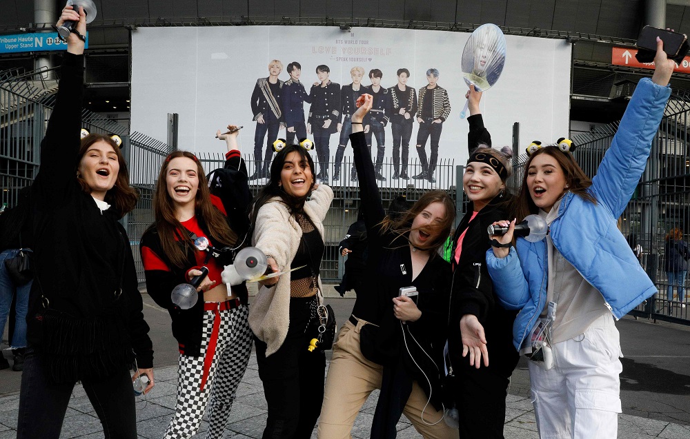 In this file photo taken on June 7, 2019, fans react as they arrive for a concert of the South Korean K-pop boy band BTS at the Stade-de-France stadium in Saint-Denis, on the outskirts of Paris. u00e2u20acu2022 AFP pic        