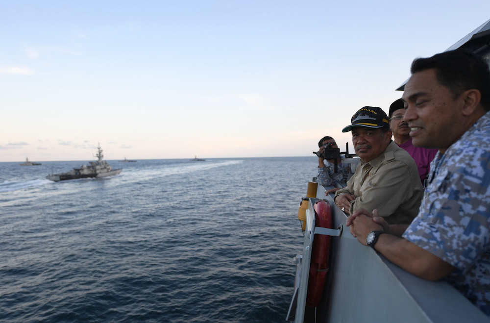 Defence Minister Mohamad Sabu watches a naval exercise aboard the KD Pahang in the waters off Kuantan May 27, 2019. u00e2u20acu201d Bernama pic