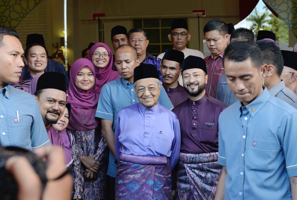 Tun Dr Mahathir Mohamad and Datuk Seri Mukhriz Mahathir pose for pictures during the Kedah mentri besaru00e2u20acu2122s Aidifiltri open house in Alor Setar June 8, 2019. u00e2u20acu201d Bernama pic