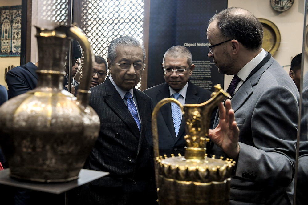 Prime Minister Tun Dr Mahathir Mohamad listens to an explanation from British Museum Deputy Director Jonathan Williams during his visit to the Albukhary Foundation Gallery at The British Museum in London June 15, 2019. u00e2u20acu201d Bernama pic