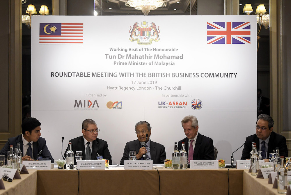 Prime Minister Tun Dr Mahathir Mohamad delivers his speech during a Roundtable Meeting with The British Business Community event in London June 17, 2019. u00e2u20acu201d Bernama pic