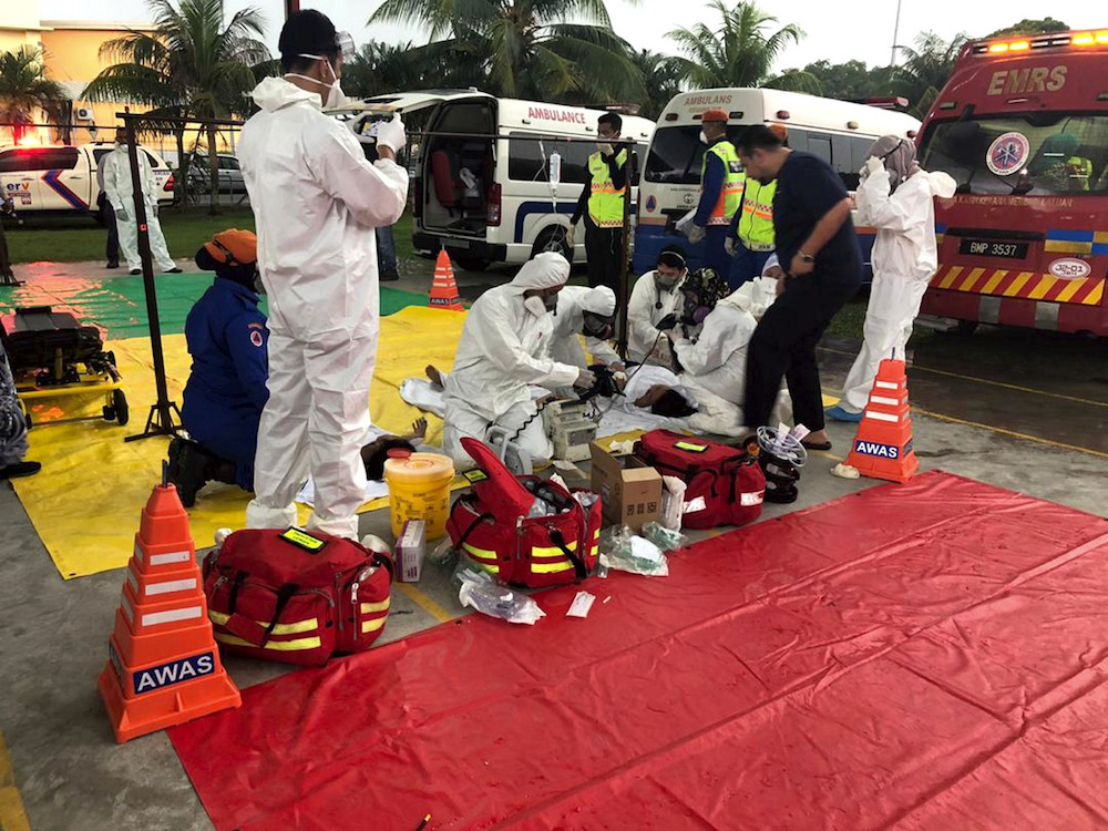 Hazmat personnel from the Johor Baru Emergency Medical Rescue Service (EMRS) are seen at Sekolah Agama Taman Mawar in Pasir Gudang June 20, 2019. — Bernama pic