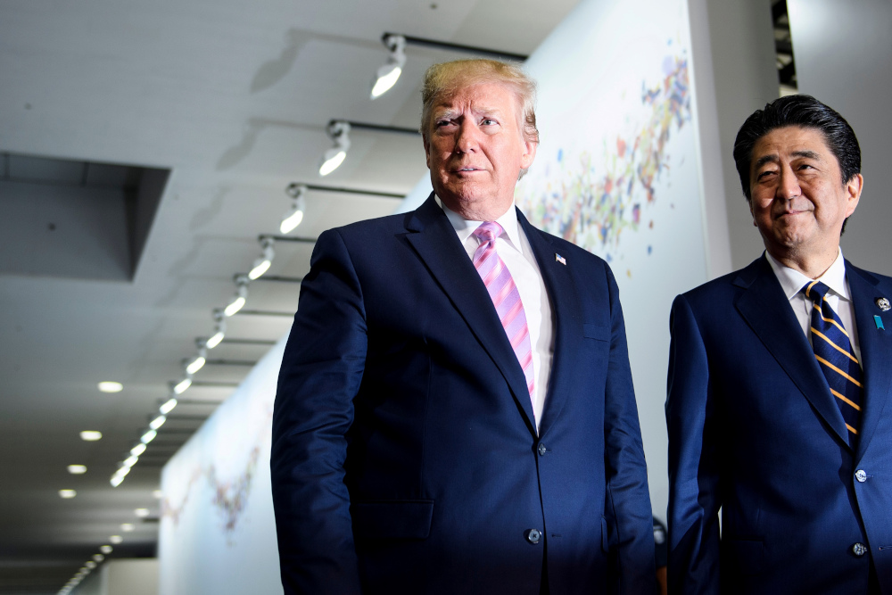 Japanu00e2u20acu2122s Prime Minister Shinzo Abe greets US President Donald Trump as he arrives for the G20 Summit in Osaka June 28, 2019. u00e2u20acu201d AFP pic
