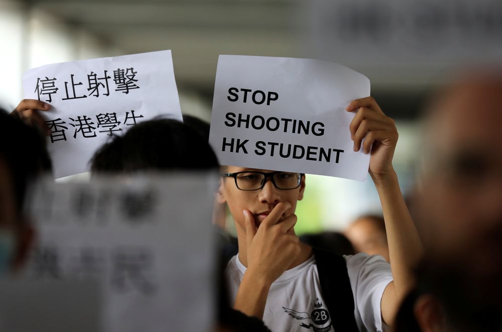 A protester holds a sign following a day of violence over an extradition bill that would allow people to be sent to mainland China for trial, in Hong Kong, China June 13, 2019. u00e2u20acu201d Reuters pic