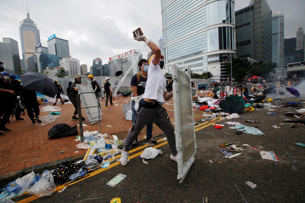 A protester throws a brick during a demonstration against a proposed extradition bill, in Hong Kong, June 12, 2019. u00e2u20acu201d Reuters pic