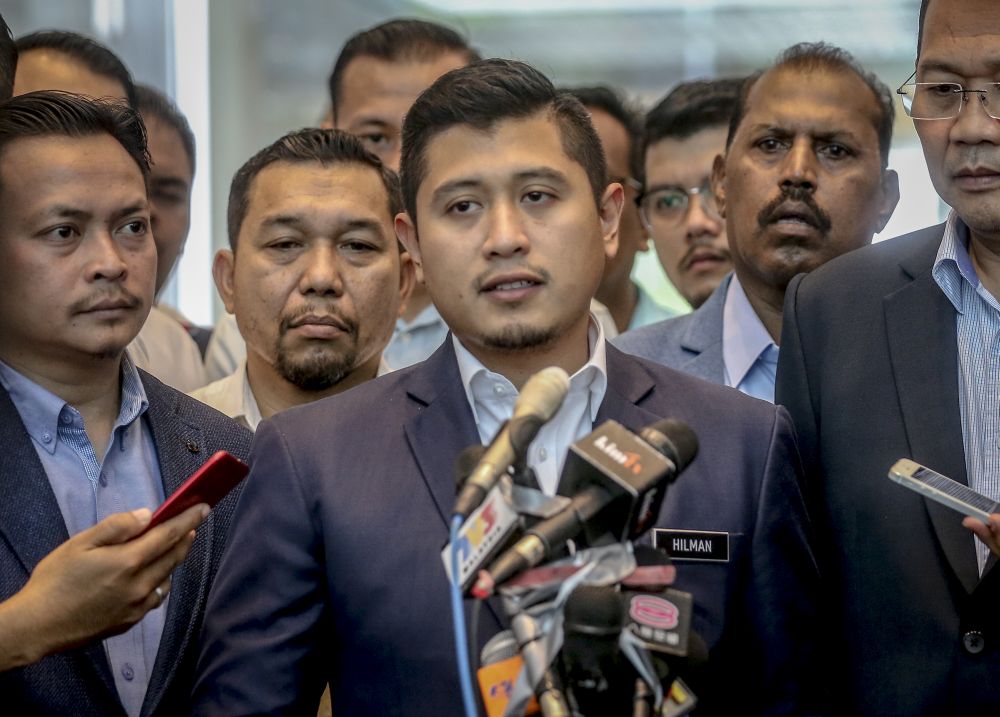 Datuk Seri Azmin Aliu00e2u20acu2122s political secretary Muhammad Hilman Idham speaks to reporters after filing a u00e2u20acu02dcqazfu00e2u20acu2122 report at the Federal Territories Islamic Religious Department in Putrajaya June 13,2019. u00e2u20acu201d Picture by Firdaus Latif