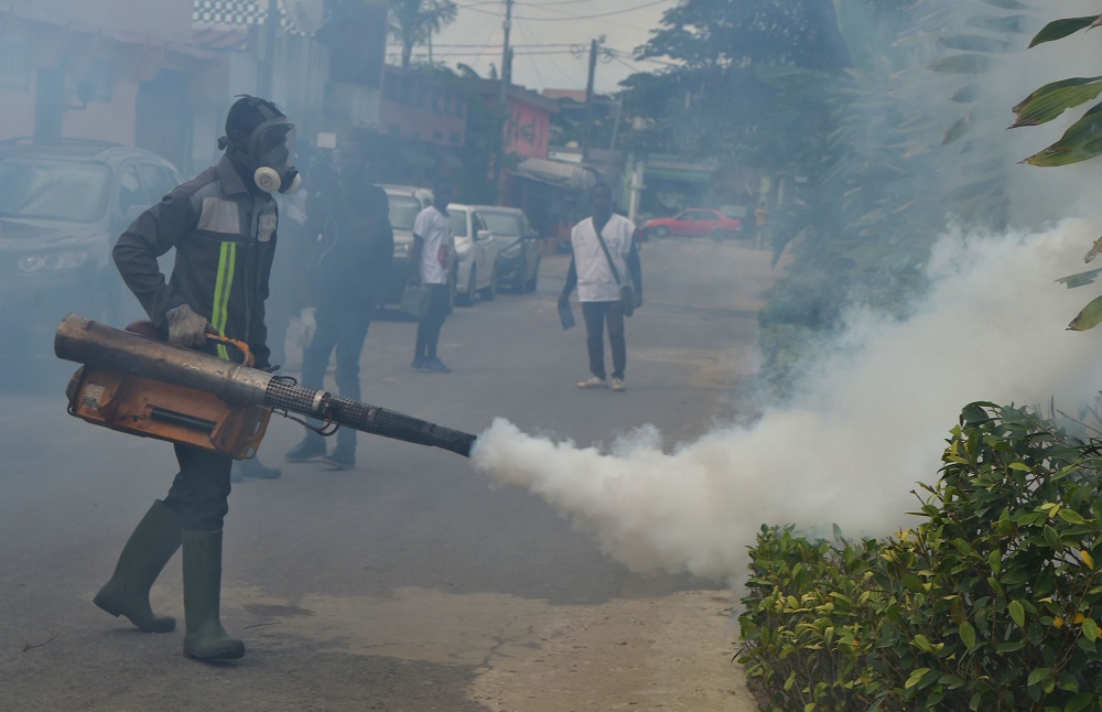 Officers of the National institute for public hygiene (INHP) are at work to fumigate an area to prevent mosquitoes from breeding, on June 3, 2019 in Abidjan, as part of a campaign against mosquito borne viruses. u00e2u20acu2022 AFP pic        