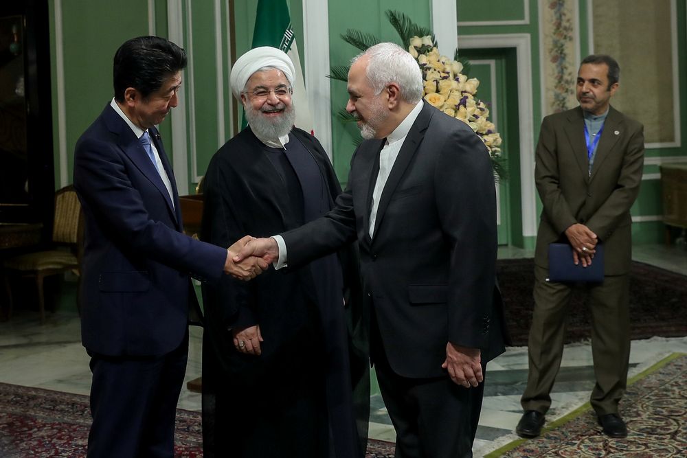 Iranian Foreign Minister Mohammad Javad Zarif shakes hands with Japanu00e2u20acu2122s Prime Minister Shinzo Abe, as Iranian President Hassan Rouhani looks on in Tehran, Iran, June 12, 2019. u00e2u20acu201d Official Iranian President picture via Reuters