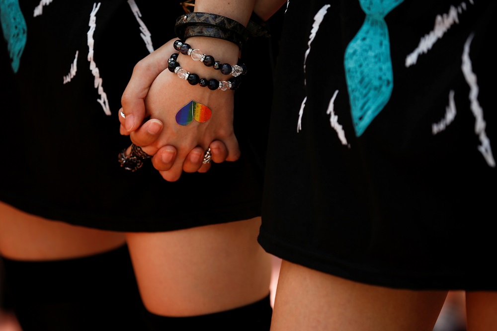 Women hold hands during the Tokyo Rainbow Pride parade celebrating lesbian, gay, bisexual, and transgender (LGBT) culture in Tokyo May 8, 2016. u00e2u20acu2022 Reuters pic      