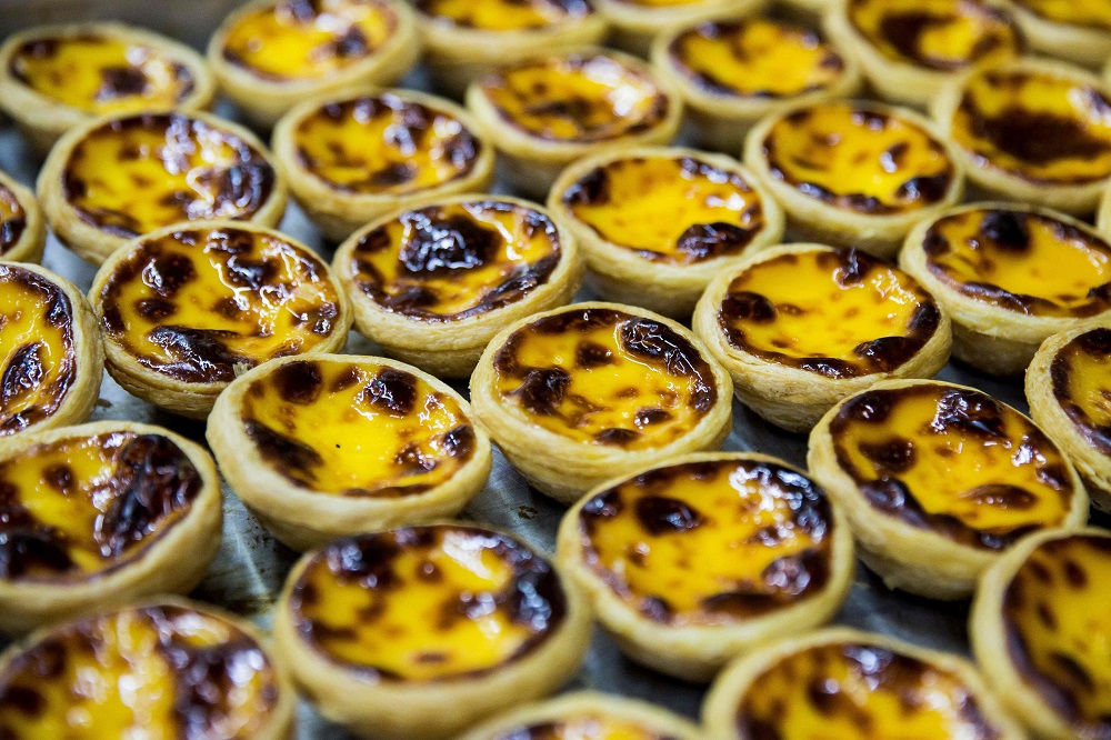 This picture taken on May 21, 2019 shows freshly baked egg tarts at Lord Stow's bakery in Macau. u00e2u20acu201d AFP pic 